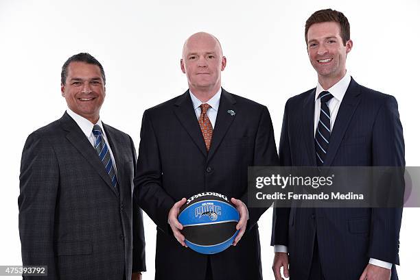 Orlando Magic CEO Alex Martins, new Magic head coach Scott Skiles and General Manager Rob Hennigan pose for a portrait on May 29, 2015 at Amway...