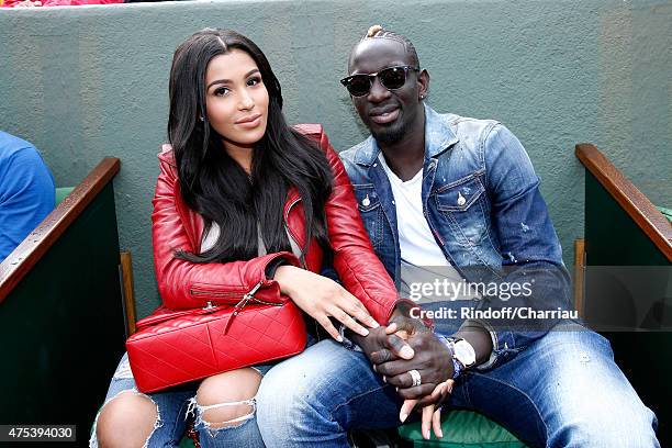 French Football player of Liverpool, Mamadou Sakho and his companion Matja attend the 2015 Roland Garros French Tennis Open - Day Eight, on May 31,...