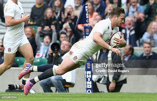 Danny Cipriani of England dives over to score his second try durng the Rugby International match between England and the Barbarians at Twickenham...