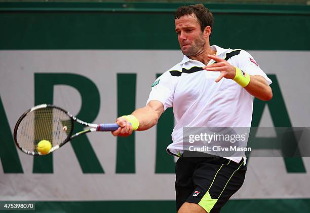 Teymuraz Gabashvili of Russia plays a forehand in his Men's Singles match against Kei Nishikori of Japan on day eight of the 2015 French Open at...