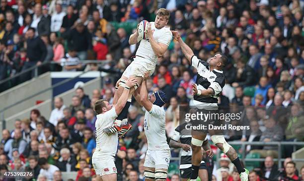 Ed Slater of England wins the lineout ball durng the Rugby International match between England and the Barbarians at Twickenham Stadium on May 31,...