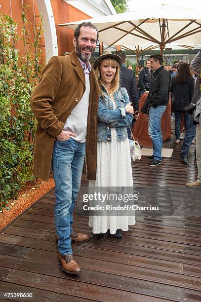 Actor Christian Vadim and his wife Julia Livage attend the French open at Roland Garros on May 31, 2015 in Paris, France.