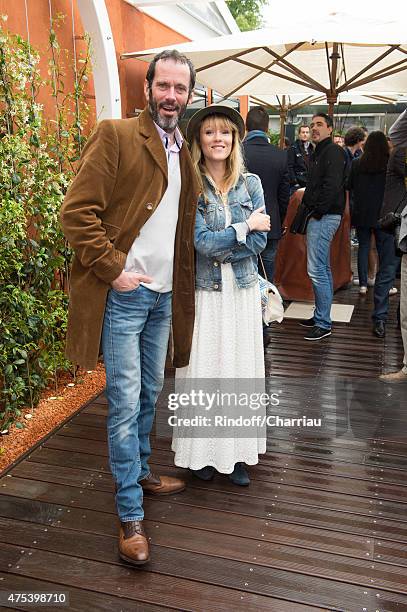 Actor Christian Vadim and his wife Julia Livage attend the French open at Roland Garros on May 31, 2015 in Paris, France.