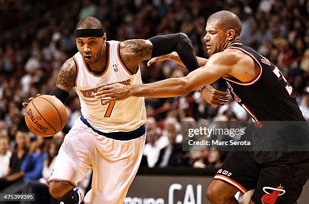 Shane Battier of the Miami Heat defends against Carmelo Anthony of the New York Knicks at AmericanAirlines Arena on February 27, 2014 in Miami,...