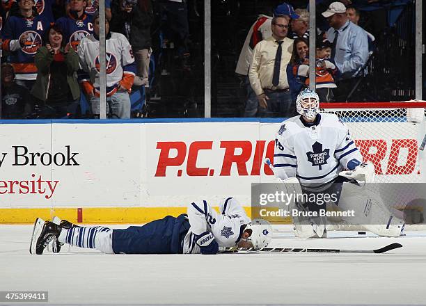 Dion Phaneuf and Jonathan Bernier of the Toronto Maple Leafs lie on the ice following a 5-4 overtime loss to the New York Islanders at the Nassau...