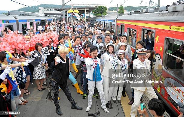 Singer Ichiro Mizuki performs during the resuming ceremony at Ishinomaki Station on May 30, 2015 in Higashimatsushima, Japan. After a more than...