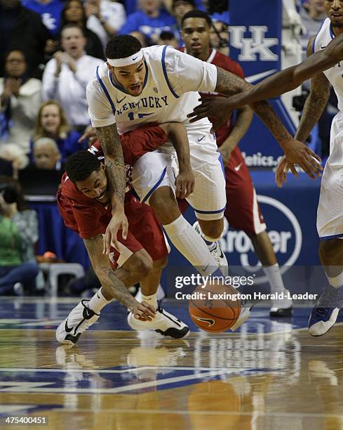Kentucky Wildcats forward Willie Cauley-Stein fights for a loose ball with Arkansas Razorbacks' Rashad Madden at Rupp Arena in Lexington, Ky., on...