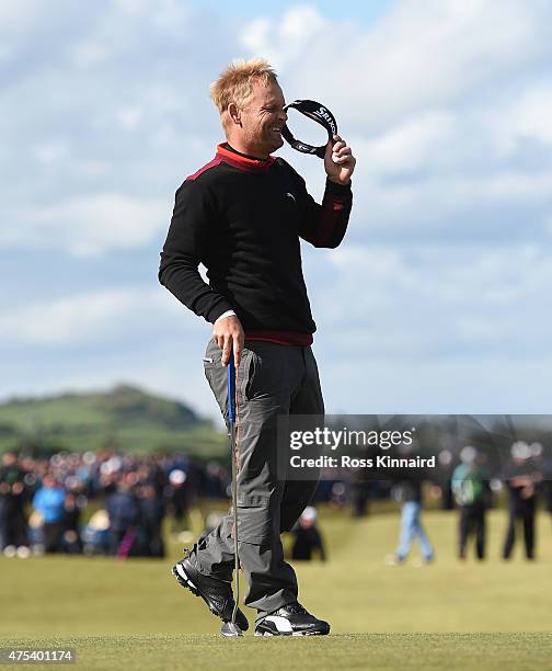 Soren Kjeldsen of Denmark reacts to his victory in a playoff on the 18th green during the Final Round of the Dubai Duty Free Irish Open Hosted by the...