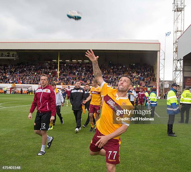 Scott McDonald of Motherwell throws his shoes into the crowd during the Scottish Premiership play-off final 2nd leg between Motherwell and Rangers at...