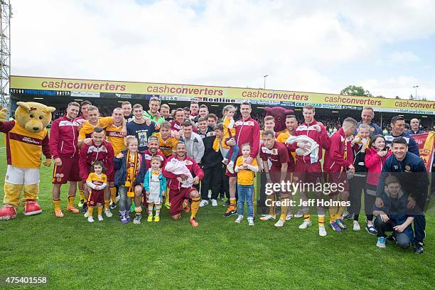 Motherwell players pose at the end of the Scottish Premiership play-off final 2nd leg between Motherwell and Rangers at Fir Park on May 31, 2015 in...