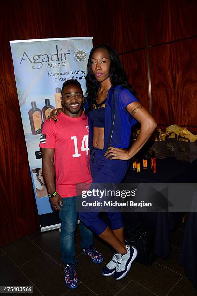 Derrick Johnson and Brigetta Barrett attend LA Gear Presents Sports Spectacular Charity Basketball Game Hosted By Tyga on May 30, 2015 in Los...