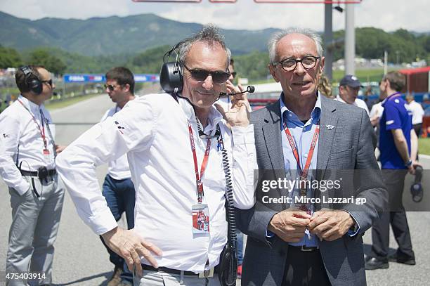 Carmelo Ezpeleta of Spain and Dorna CEO and Franco Uncini of Italy and Dorna FIM Security Commission look on on the grid during the MotoGP race...