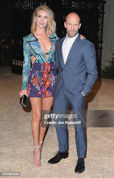 Rosie Huntington-Whiteley and actor Jason Statham attend the Burberry "London in Los Angeles" event at Griffith Observatory on April 16, 2015 in Los...