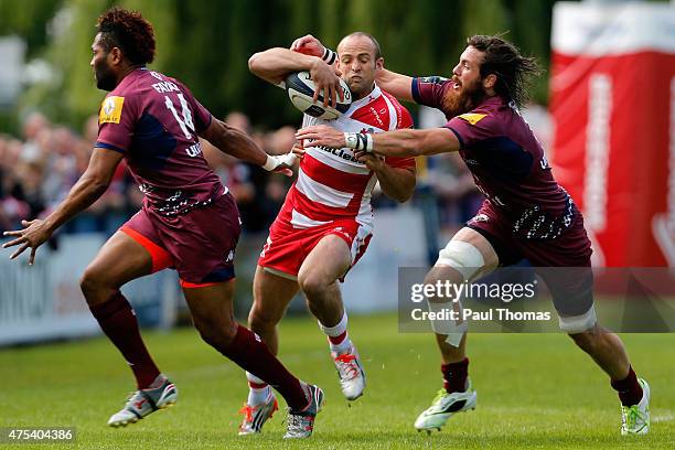 Charlie Sharples of Gloucester is tackled by Hugh Chalmers of Bordeaux during the European Champions Cup Play-Off match between Gloucester Rugby and...