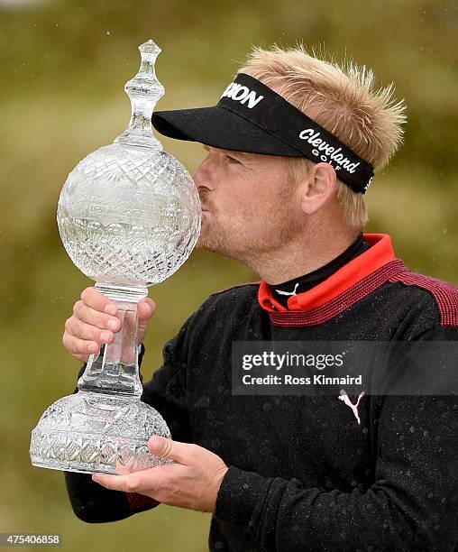 Soren Kjeldsen of Denmark poses with the trophy after his victory in a playoff during the Final Round of the Dubai Duty Free Irish Open Hosted by the...