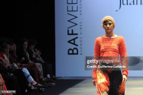 Model walks the runway during Juana de Arco show at the Buenos Aires Fashion Week in Predio Ferial La Rural on February 27, 2014 in Buenos Aires,...