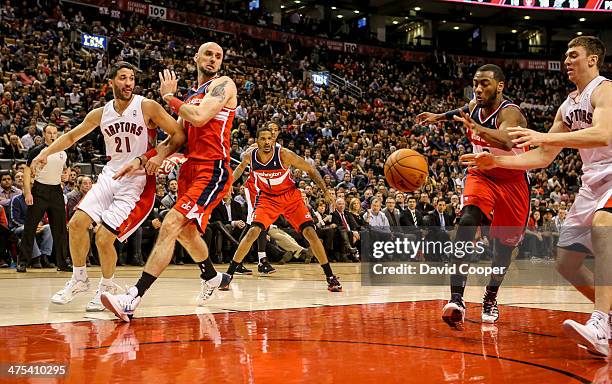 Toronto Raptors point guard Greivis Vasquez tries to pass to Toronto Raptors power forward Tyler Hansbrough under the basket but it was knocked away...