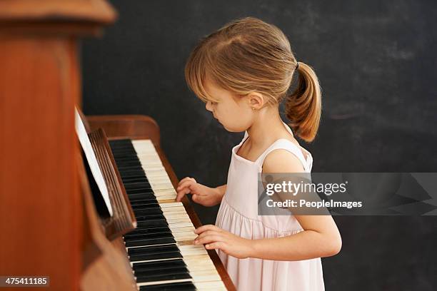 practising for her recital - pianist stock pictures, royalty-free photos & images