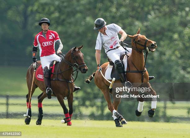 Prince Harry in action during day two of the Audi Polo Challenge at Coworth Park on May 31, 2015 in London, England.