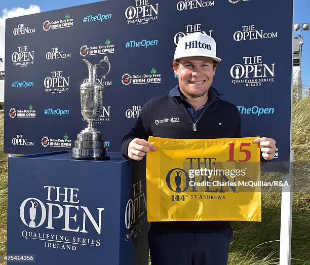 Tyrrell Hatton of England, who qualified for the Open Championship, poses during the final round of the Dubai Duty Free Irish Open Hosted by the Rory...