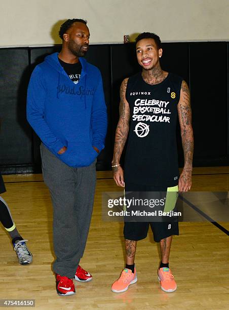Baron Davis and Tyga attend LA Gear Presents Sports Spectacular Charity Basketball Game Hosted By Tyga on May 30, 2015 in Los Angeles, California.