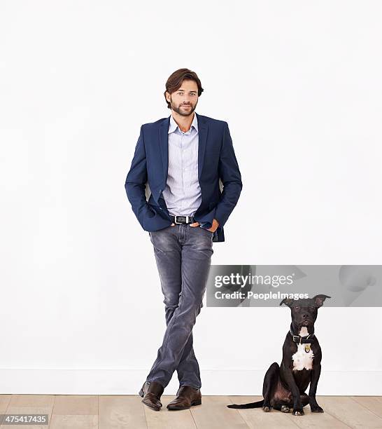 proud of his canine sidekick - goed gekleed stockfoto's en -beelden