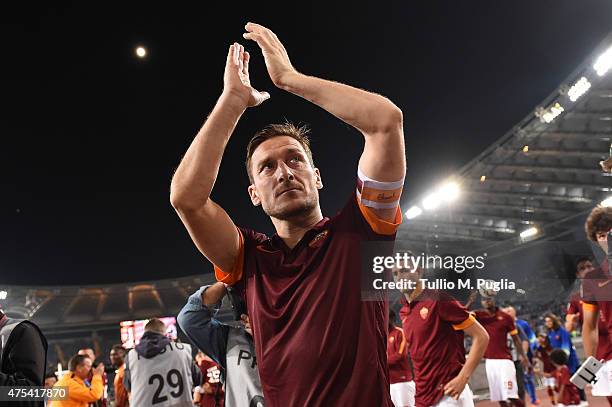 Francesco Totti of Roma greets supporters after the Serie A match between AS Roma and US Citta di Palermo at Stadio Olimpico on May 31, 2015 in Rome,...