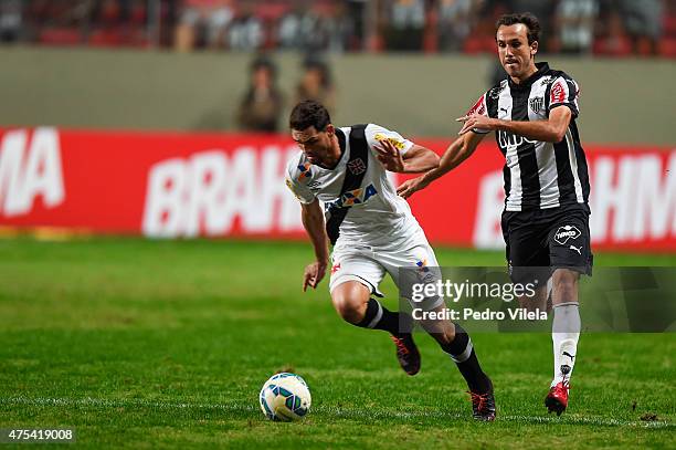 Thiago Ribeiro of Atletico MG and Gilberto of Vasco battle for the ball during a match between Atletico MG and Vasco as part of Brasileirao Series A...