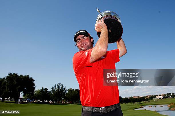 Steven Bowditch of Australia celebrates with the trophy after his four-stroke victory at the AT&T Byron Nelson at the TPC Four Seasons Resort Las...