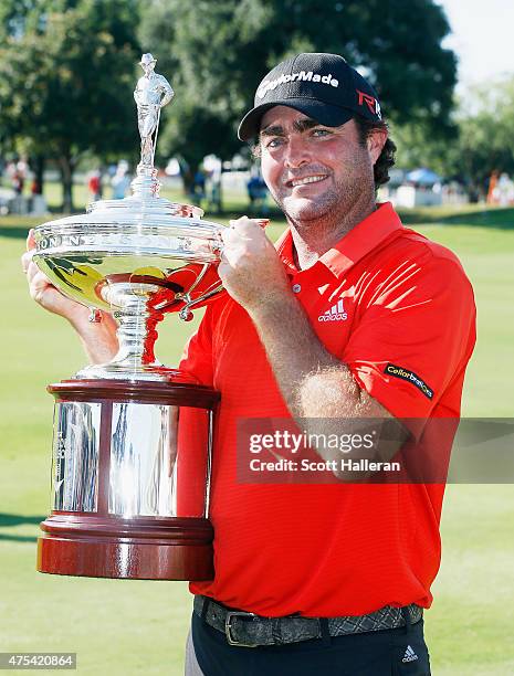 Steven Bowditch of Australia poses with the trophy after his four-stroke victory at the AT&T Byron Nelson at the TPC Four Seasons Resort Las Colinas...