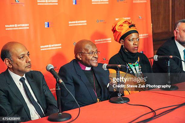 Anant Singh, Desmond Tutu, Mpho Andrea Tutu, Ebrahim Rasool speak at a panel at 2014 Shared Interest Awards gala on February 27, 2014 in New York...