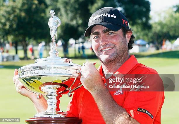 Steven Bowditch of Australia poses with the trophy after his four-stroke victory at the AT&T Byron Nelson at the TPC Four Seasons Resort Las Colinas...