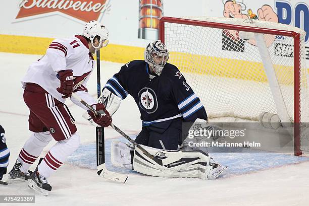 Martin Hanzal of the Phoenix Coyotes scores on Ondrej Pavelec of the Winnipeg Jets in third-period action in an NHL game at the MTS Centre on...