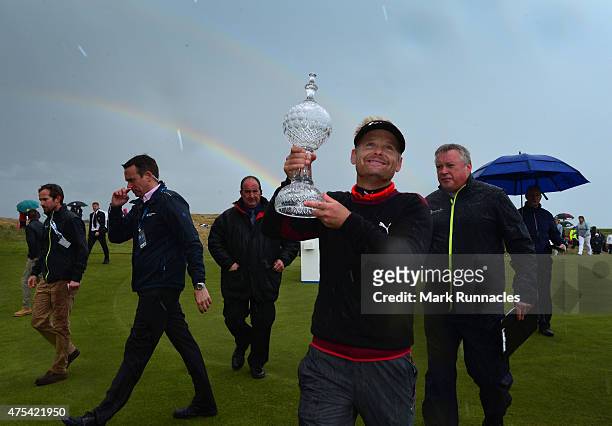 Soren Kjeldsen of Denmark celebrates winning the Dubai Duty Free Irish Open hosted by the Rory Foundation at Royal County Down Golf Club on May 31,...