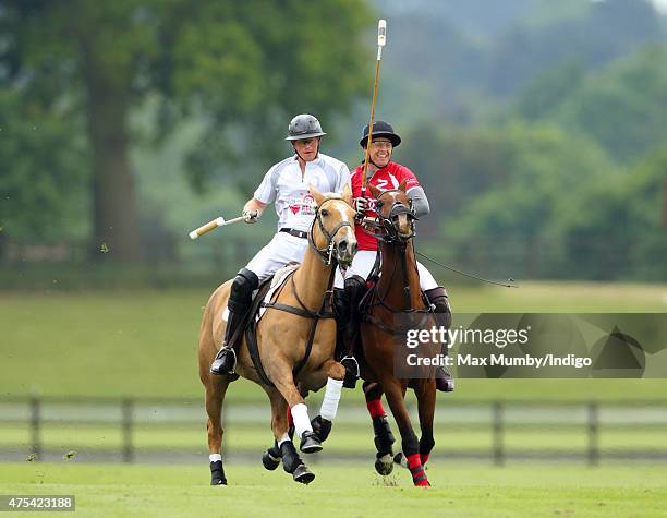 Prince Harry plays polo on day 2 of the Audi Polo Challenge at Coworth Park on May 31, 2015 in Ascot, England.