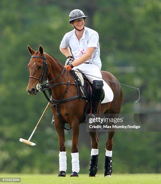 Prince Harry plays polo on day 2 of the Audi Polo Challenge at Coworth Park on May 31, 2015 in Ascot, England.