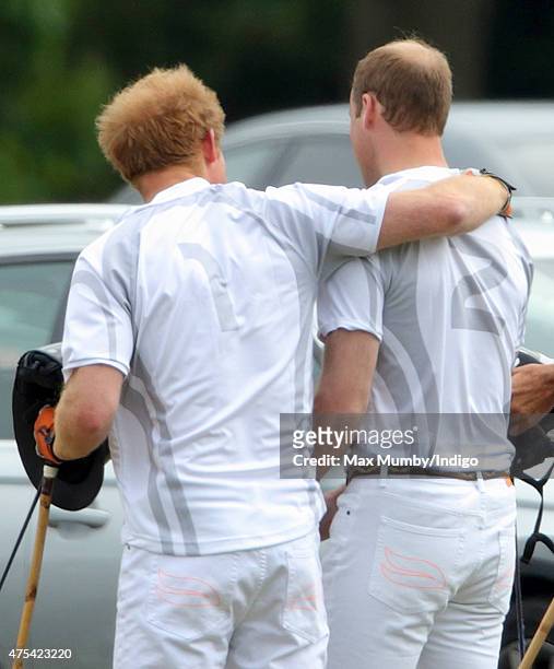 Prince Harry and Prince William, Duke of Cambridge embrace as they attend day 2 of the Audi Polo Challenge at Coworth Park on May 31, 2015 in Ascot,...