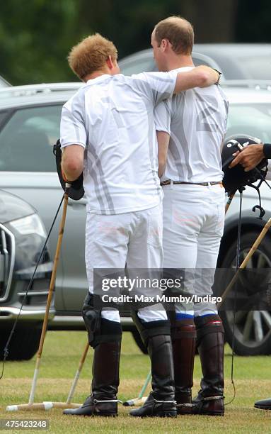 Prince Harry and Prince William, Duke of Cambridge embrace as they attend day 2 of the Audi Polo Challenge at Coworth Park on May 31, 2015 in Ascot,...