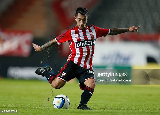 Luciano Acosta of Estudiantes kicks the ball during a match between Estudiantes and Colon as part of 14th round of Torneo Primera Division 2015 at...