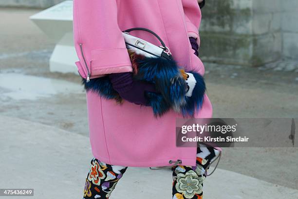 Editor-at-large and Creative Consultant for Vogue Japan Anna Dello Russo wears a Fendi bag and fendi Monster, Miu Miu coat on day 3 of Paris...