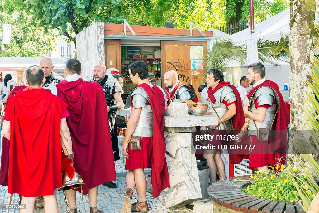 Roman soldiers discussing strategy in the streets