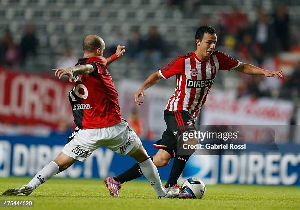 Leonardo Jara of Estudiantes fights for the ball with Cristian Llama of Colon during a match between Estudiantes and Colon as part of 14th round of...