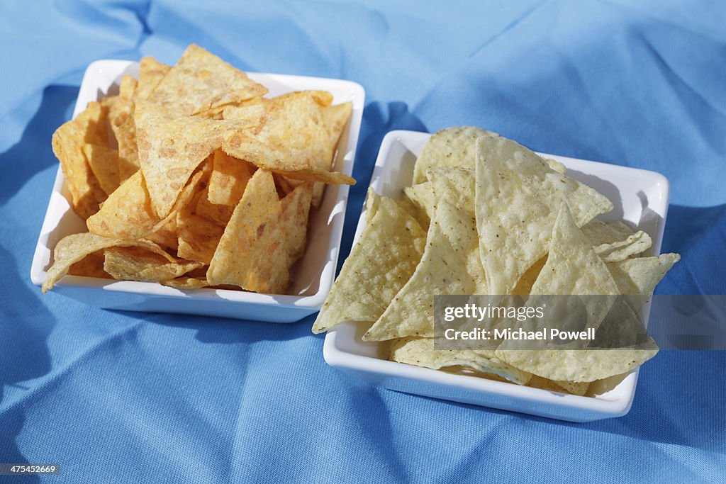 Tortilla chips in white bowls