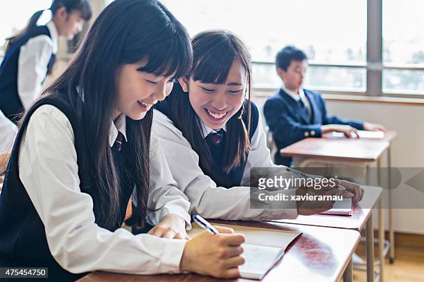 japanese girls working in the classroom - japan 12 years girl stock pictures, royalty-free photos & images