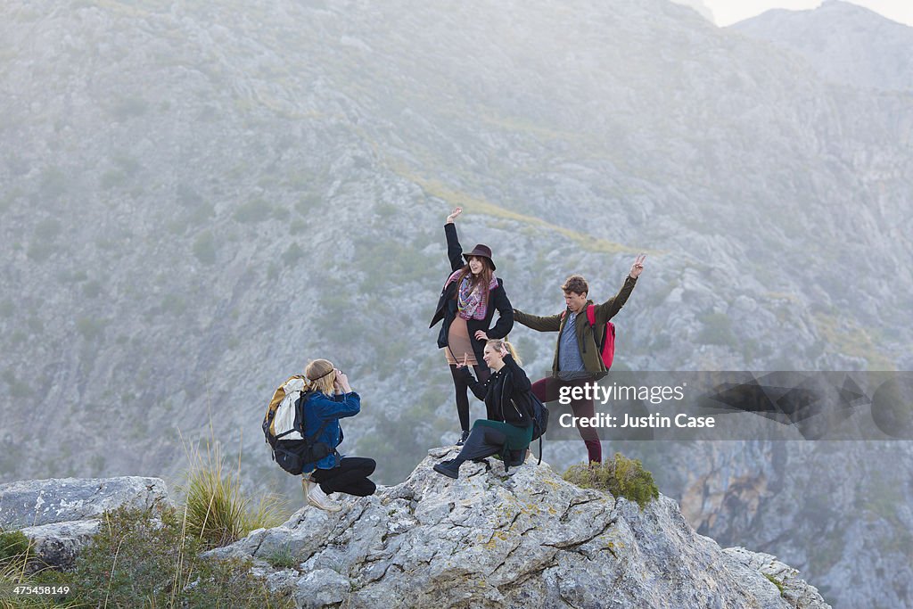 Friends making a photo on top of the mountain