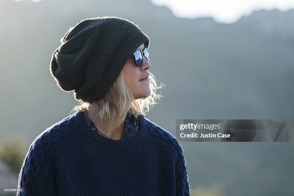 Young blond boy looking away on a sunny day