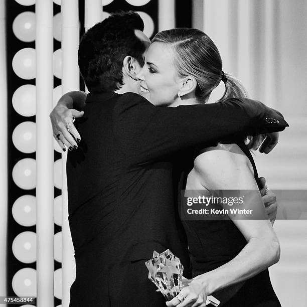 Honoree Seth MacFarlane accepts the Critics Choice Louis XIII Genius Award from actress Charlize Theron onstage during the 5th Annual Critics'...