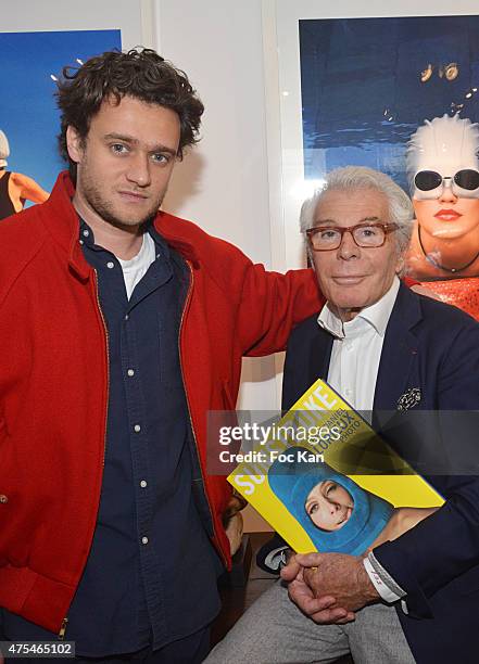 Photographer Nickolas Lorieux and his fatherJean Daniel Lorieux attend the Jean Daniel Lorieux Photo Exhibition book signing at Galerie Bernard Dulon...