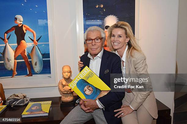 Fashion photographer Jean Daniel Lorieux and Laura Restelli Brizard attend the Jean Daniel Lorieux Photo Exhibition book signing at Galerie Bernard...