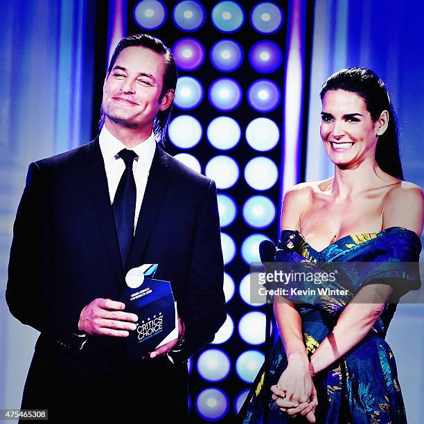 Actors Josh Holloway and Angie Harmon speak onstage during the 5th Annual Critics' Choice Television Awards at The Beverly Hilton Hotel on May 31,...